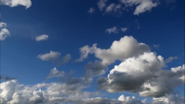 Epic time lapse shot ofing white and grey clouds against blue sky in nature - Climate Change and glo