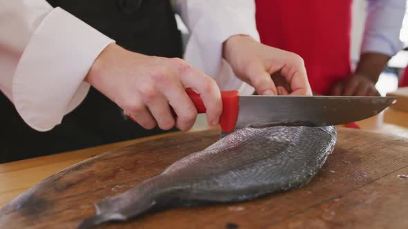 Chef cutting a fish