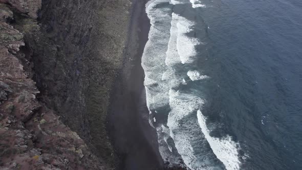 Ocean Waves Crashing At The Black Volcanic Sand Of Playa Nogales In La Palma, Spain.  aerial, forwar