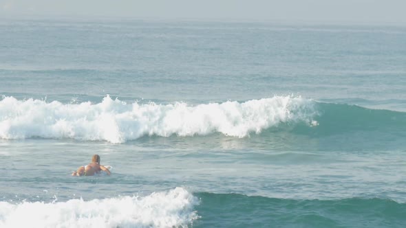 Woman Surfs and Flips on White Board in Heavy Ocean Waves