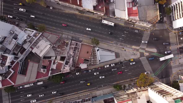 Drone top view showing Cordoba Avenue fork in Buenos Aires city with busy vehicles after work