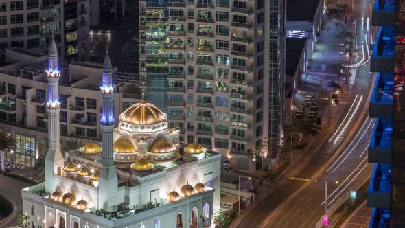 Modern Residential Architecture of Dubai Marina and Mohammed Bin Ahmed Almulla Mosque Aerial Night