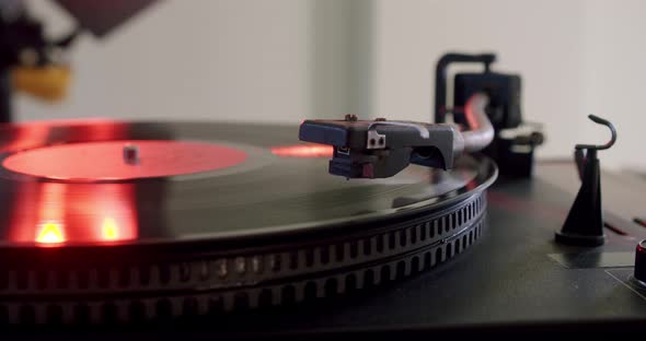 Hand Turns on a Vintage Vinyl Record and Vinyl Record is Spinning