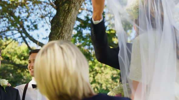 Groom happily looking at bride and her father 4K 4k