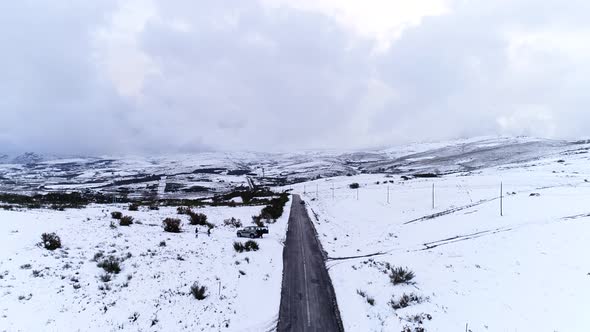 Flying Over Snowy Mountain Road