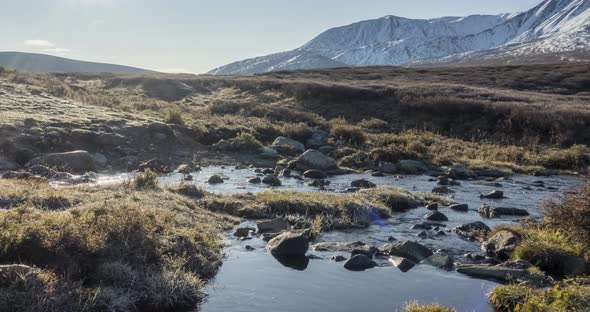 Mountain Meadow Timelapse at the Summer or Autumn Time. Wild Nature and Rural Valley. Sun Rays