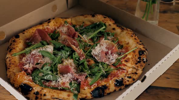 Close-up Of People Hands Taking Slices Pizza From Food Delivery Open Box. Tasty Service To Office