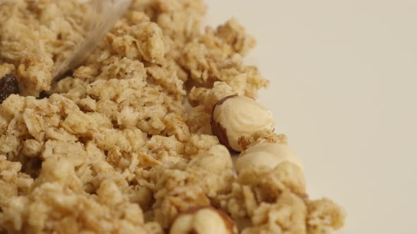 Muesli with hazel nuts  close-up 4K 2160p 30fps UltraHD panning footage - Dehydrated  crunchy cereal