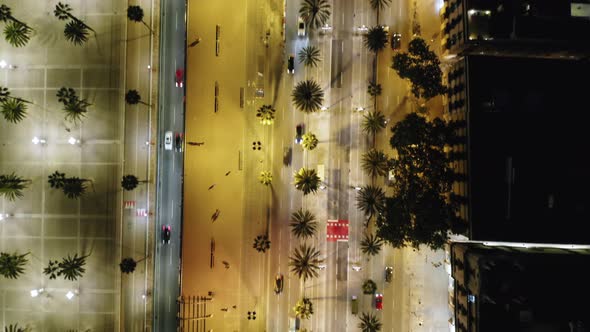 Cityscape of Barcelona at night with Passeig de Colom and Port Vell walkway, Spain