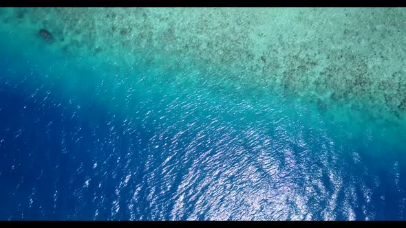 Aerial drone panorama of exotic island beach adventure by clear sea with white sandy background of a