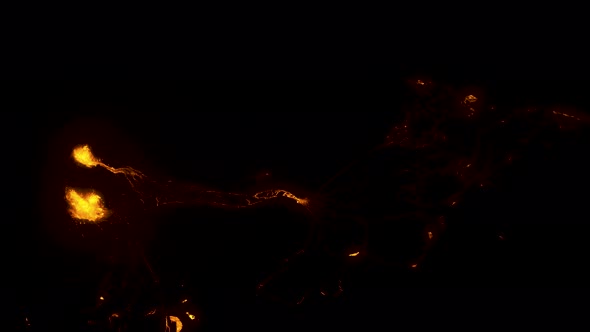 Aerial view above the Fagradalsfjall volcano craters and glowing lava - top down, drone shot