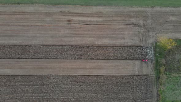 Aerial View of Plowing Action in the Spring Season Agricultural Field