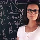 Happy Smart Girl Student Over High School Math And Science Formulas On Backboard - VideoHive Item for Sale