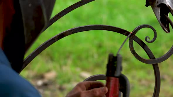 Construction Worker Welding Iron Close Up