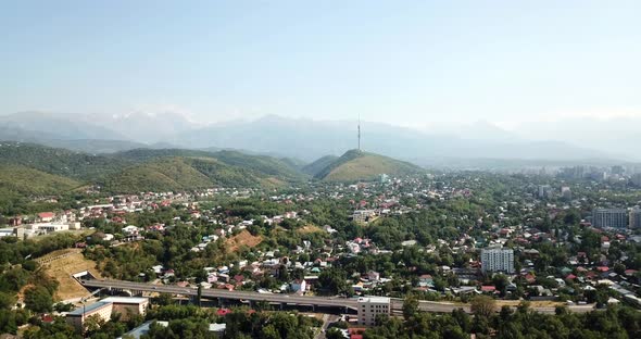 Green City with Snowy Mountains of Almaty