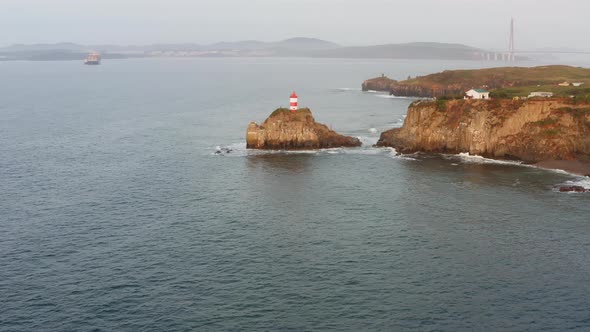 Drone View of the Picturesque Old Basargin Lighthouse on the Coast of the Sea