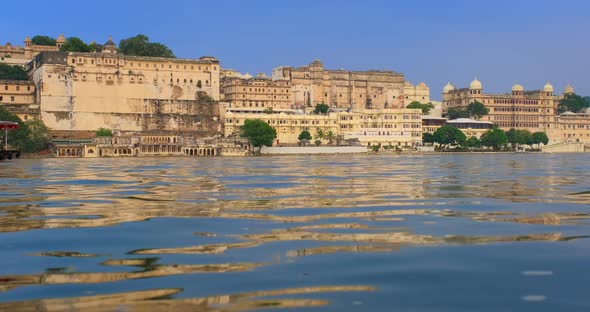 Udaipur City Palace on Lake Pichola with Tourist Boat - Rajput Architecture of Mewar Dynasty Rulers