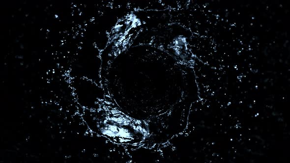 Super Slow Motion Shot of Rotating Water Splash Isolated on Black Background at 1000Fps