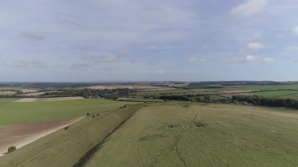 Aerial tracking along the northern ramparts of Maiden castle towards the eastern gate. The Roman tem