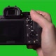 Professional DSLR Photo Camera with Lens at Green Background - VideoHive Item for Sale