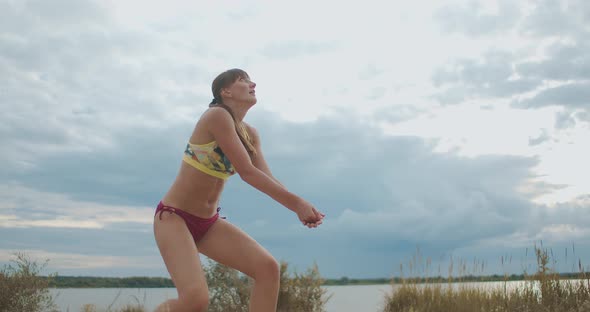 Beach Volleyball Match of Two Female Team, Young Athletic Women Are Jumping and Striking Ball