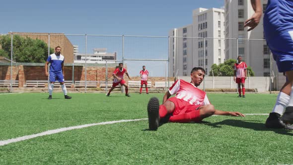 Soccer players having match on the field