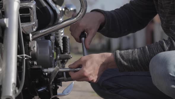 Man Repairing His Motorcycle