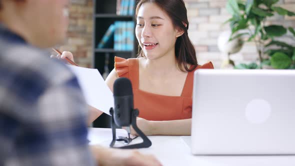 Female Podcaster Interviewing Guest