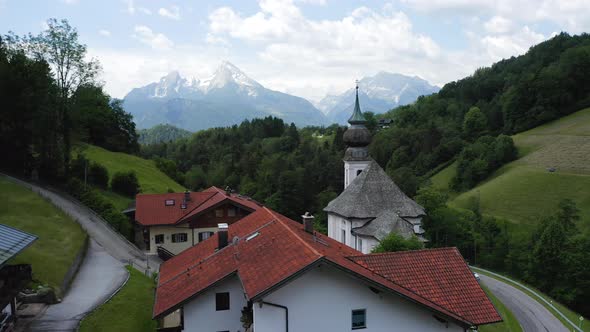 Aerial Fly Near Church Maria Gern on Sunny Day Mount Watzmann in Background Berchtesgaden Bavaria