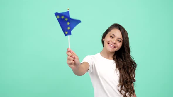 Kid with Smiling Face Waving European Union Blue Flag Showing Thumb Up European Union