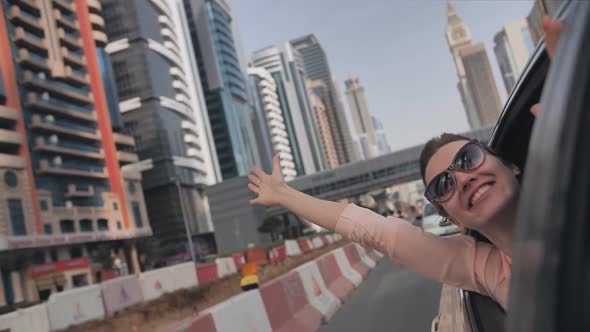 Happy Girl Travels By Car in Dubai