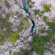 Flight Over a Mountain River and a Trail to a Gorge Among a Coniferous Forest - VideoHive Item for Sale