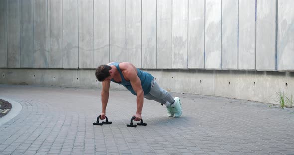 Young Man Athlete Doing Push Ups Outdoors