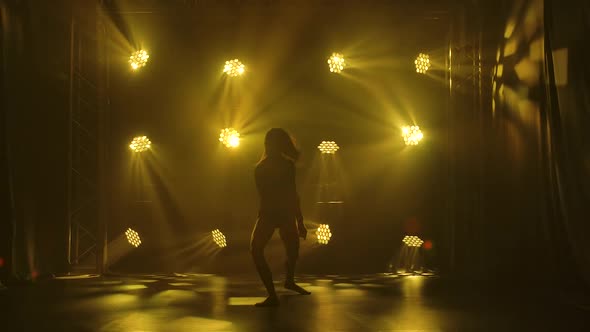 Trendy Young Woman Dancing Single in Club, Neon Light, Lots of Smoke. Fashion Street Wear