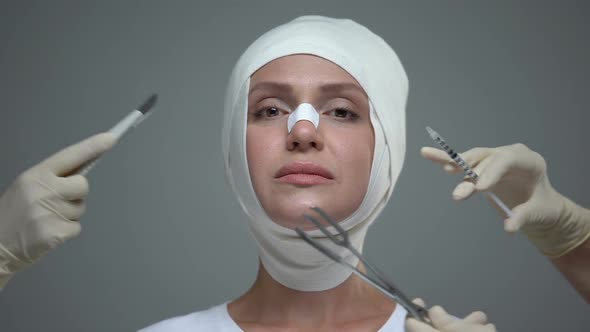 Doctors Hands Holding Medical Equipment Near Female Face, Plastic Surgery