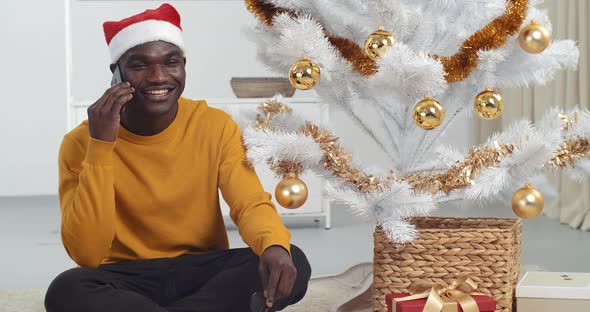 Afro American Man Black Guy Speaks on Mobile Phone Uses Smartphone To Communicate with Friends