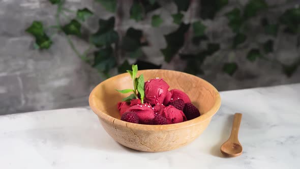 Raspberry Sorbet in Wooden Bowl Outdoors