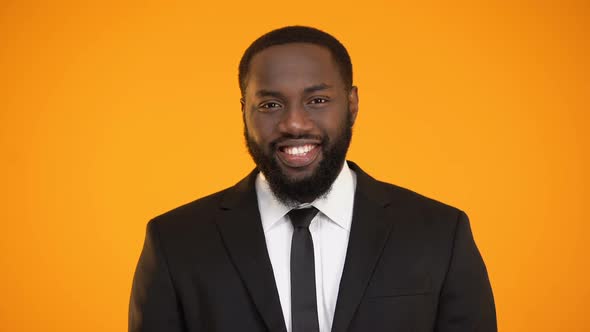 African-American Man in Suit Smiling and Looking to Camera, Sales Representative