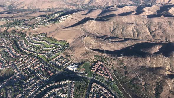 Aerial Video of the Santa Ana Mountain and homes in Southern Californaia .