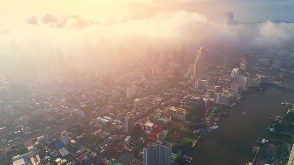 4K : Drones fly over the Chao Phraya River, buildings and business districts