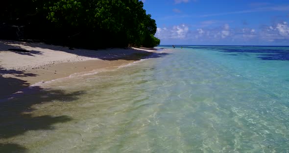 Beautiful above travel shot of a white sand paradise beach and blue sea background in best quality 4