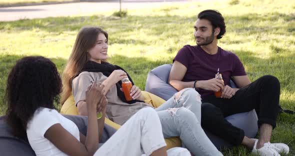 Multi Ethnic Students Having Lunch at Park