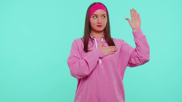 Sincere Responsible Teen Girl Raising Hand to Take Oath Promising to Be Honest and to Tell Truth