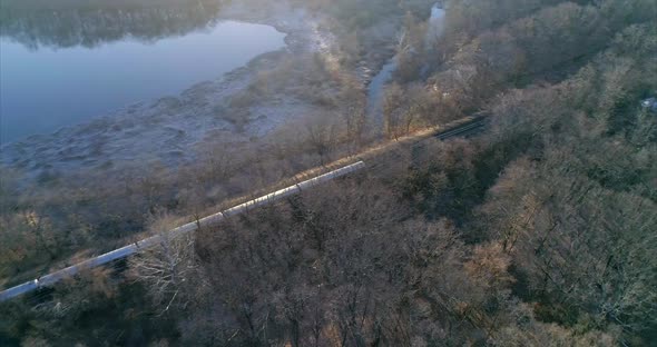 Aerial Pan Around of a Train Passing Through Westchester New York