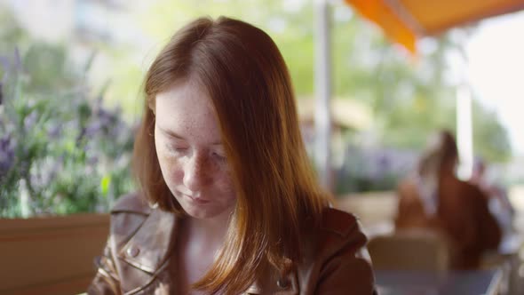 Close up of Teenage Girl in Cafe