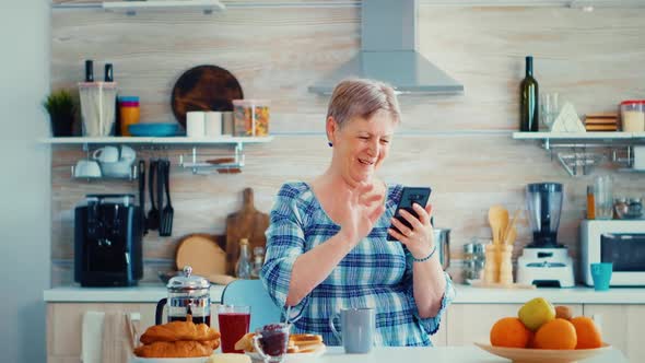 Senior Woman Waving