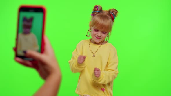 Dancing Young Little Kid Girl Blogger Record Dance Moves at Camera for Social Media Content on Phone