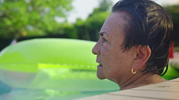Medium Shot of Older Woman Inside a Pool