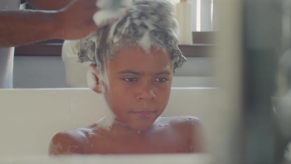 African American Kid Bathing with Dad