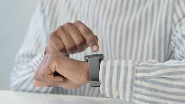 Hands Close Up of African Man Using Smart Watch